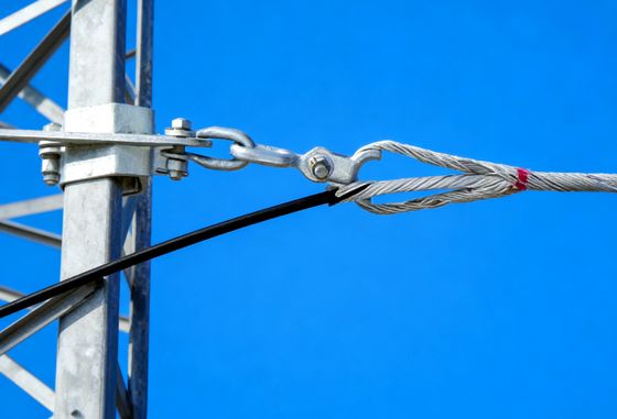 Preformed Helical Wrap Guy Grip Termination Providing Strain Relief and Enhanced Stability in Power Distribution Networks